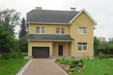 Двухэтажный дом из пеноблоков с гаражом